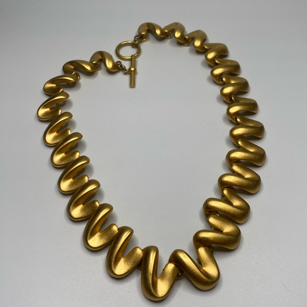 Amazing brushed metal necklace.